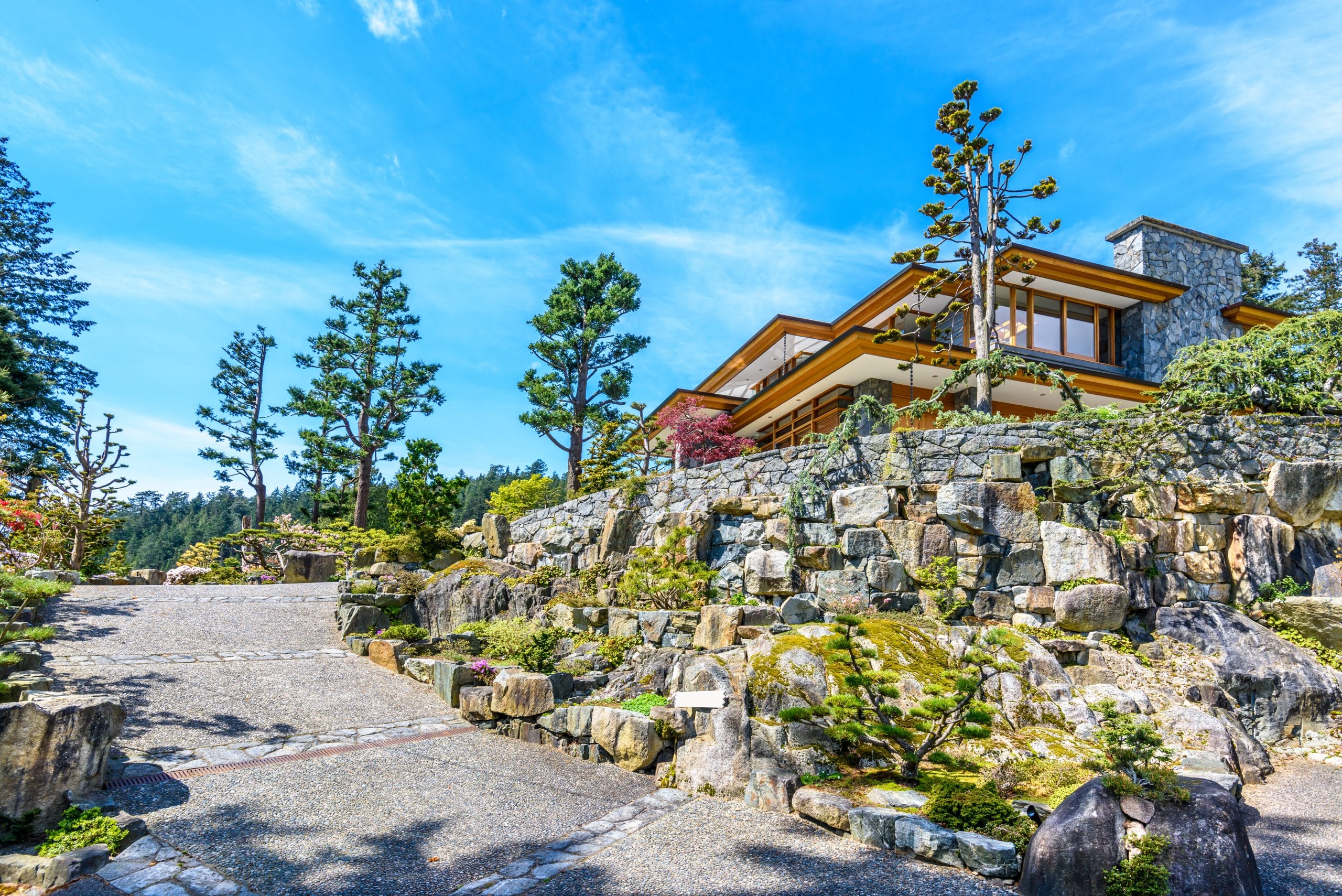 Engineered stone retaining walls terracing a steep North Shore building site