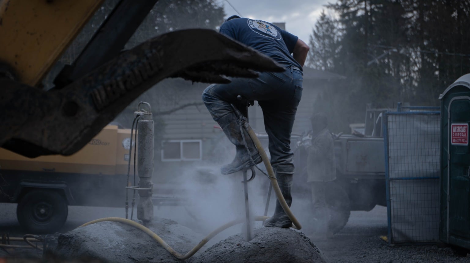 Breaking rock on a North Vancouver site at dusk